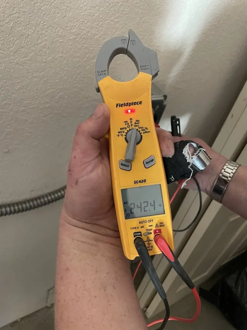 Voltage testing with clamp meter during Aluminum Wiring Replacement in Irving